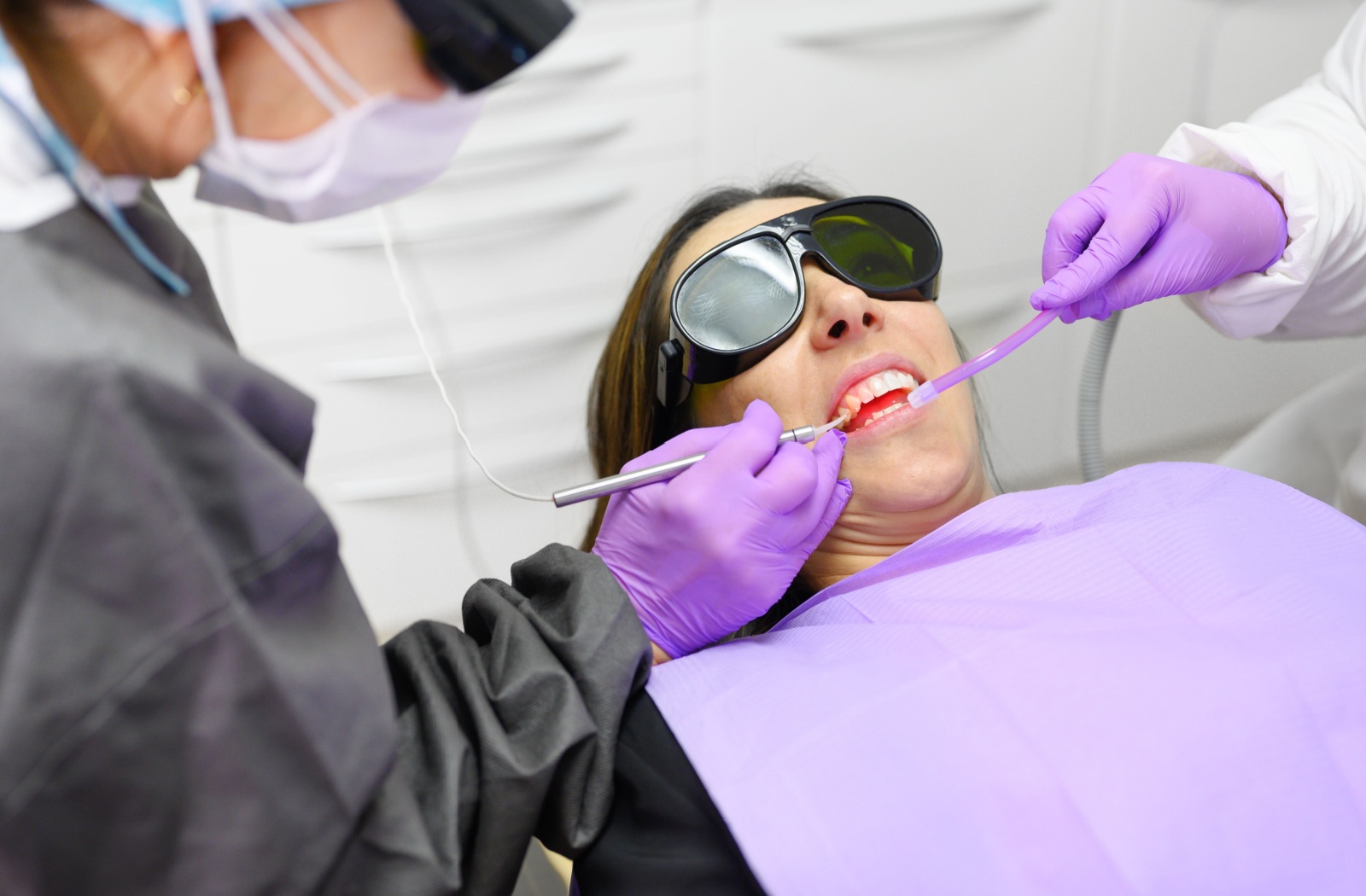 A patient at the dentist receiving treatment for periodontal disease.
